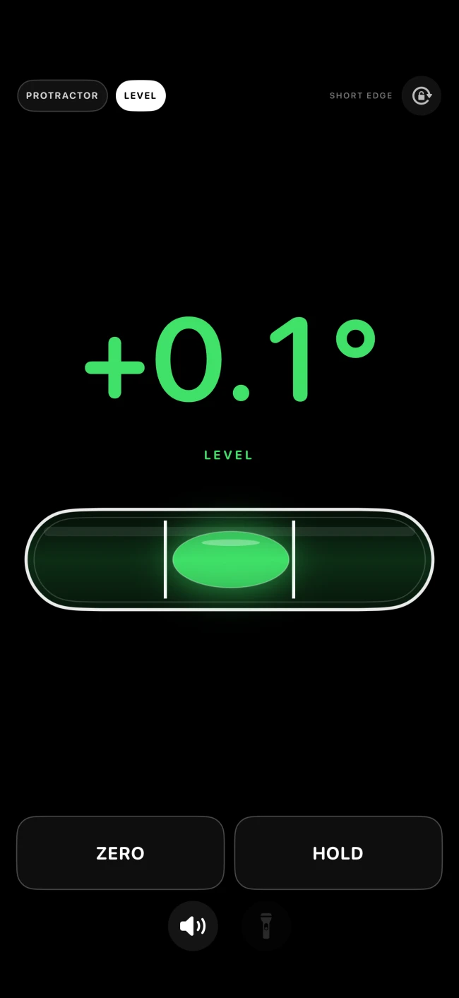 Bubble level app screen with white center lines and a glowing lime-green bubble